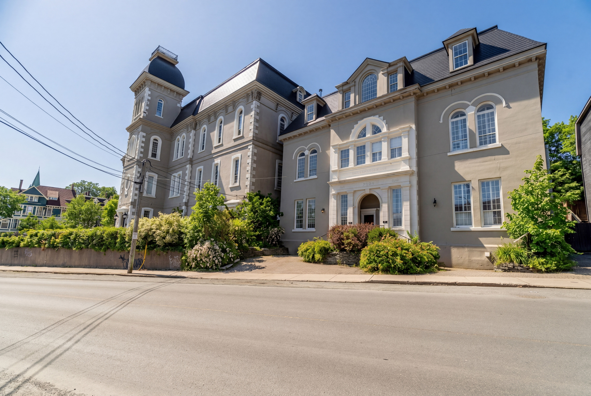 Queens Hall luxury vacation rental in St. John's, Newfoundland — Street view of Queens Hall, a historic mansard-roofed home on Queens Road in downtown St. John's